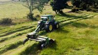 John Deere 6920 Tractor and Mower cutting Grass for Silage on a Farm in the UK