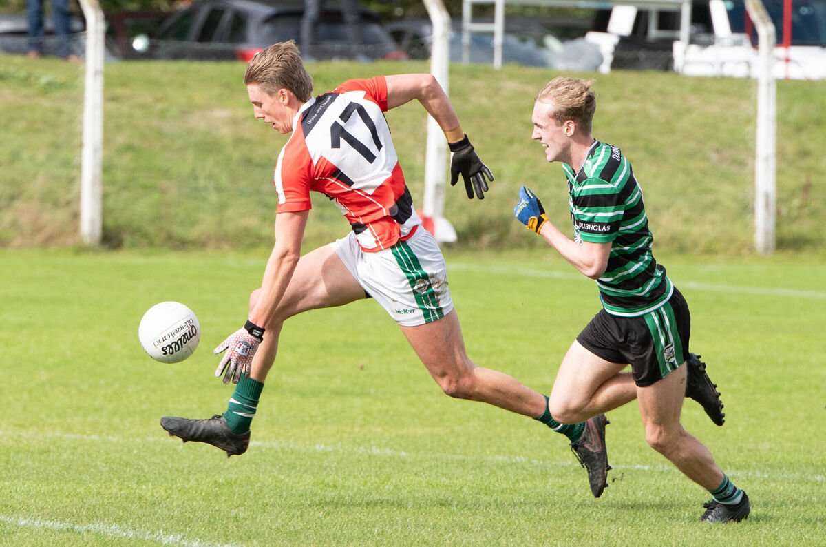 Ballincollig's Liam O'Connell races past Luis Dwan-Fogarty of Douglas this year. Picture: Howard Crowdy