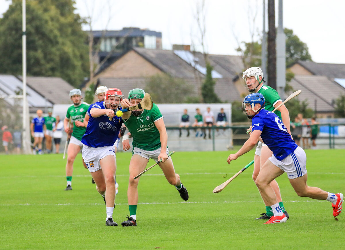 Ballinhassig's Charlie Grainger and Ballincollig's Seán O'Neill tussle for the ball. Picture: David Creedon Ballinhassig's Charlie Grainger and Ballincollig's Seán O'Neill tussle for the ball. Picture: David Creedon