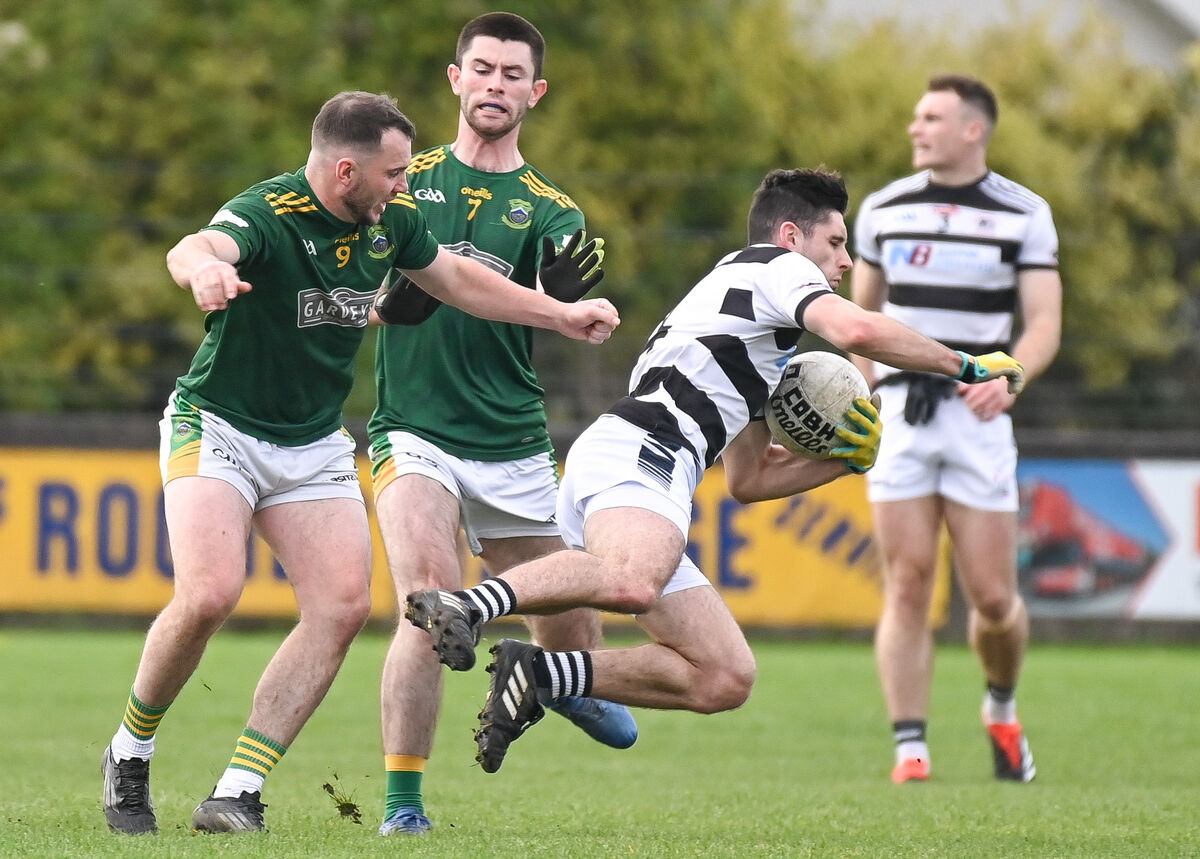  St Nick's Ciaran Horgan is sent flying after a strong challenge by Cobh's George Keating during their Premier JFC semi-final clash at Carrigtwohill. Picture: David Keane.