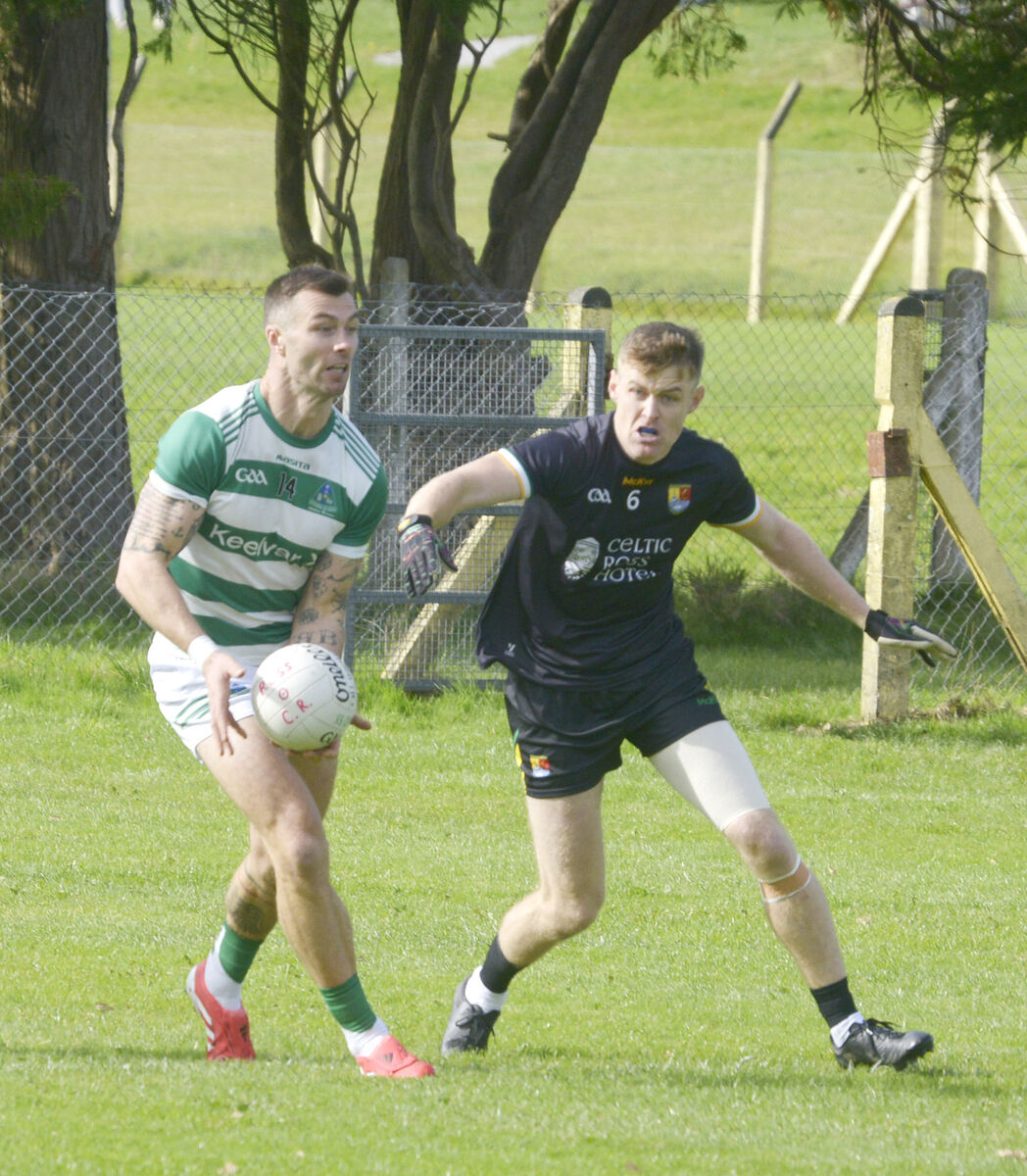 Fiachra Lynch of Valley Rovers gets his pass away despite the attentions of Carbery Rangers' Jerry O'Riordan. Picture: Denis Boyle