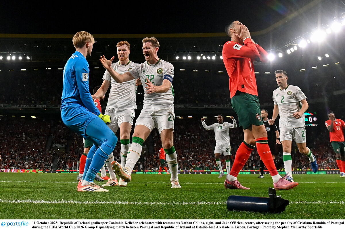 Republic of Ireland goalkeeper Caoimhin Kelleher celebrates with teammates Nathan Collins, right, and Jake O'Brien, centre, after saving the penalty of Cristiano Ronaldo of Portugal during the FIFA World Cup 2026 Group F qualifying match between Portugal and Republic of Ireland at Estádio José Alvalade in Lisbon, Portugal. Photo by Stephen McCarthy/Sportsfile Republic of Ireland goalkeeper Caoimhin Kelleher celebrates with teammates Nathan Collins, right, and Jake O'Brien, centre, after saving the penalty of Cristiano Ronaldo of Portugal during the FIFA World Cup 2026 Group F qualifying match between Portugal and Republic of Ireland at Estádio José Alvalade in Lisbon, Portugal. Photo by Stephen McCarthy/Sportsfile
