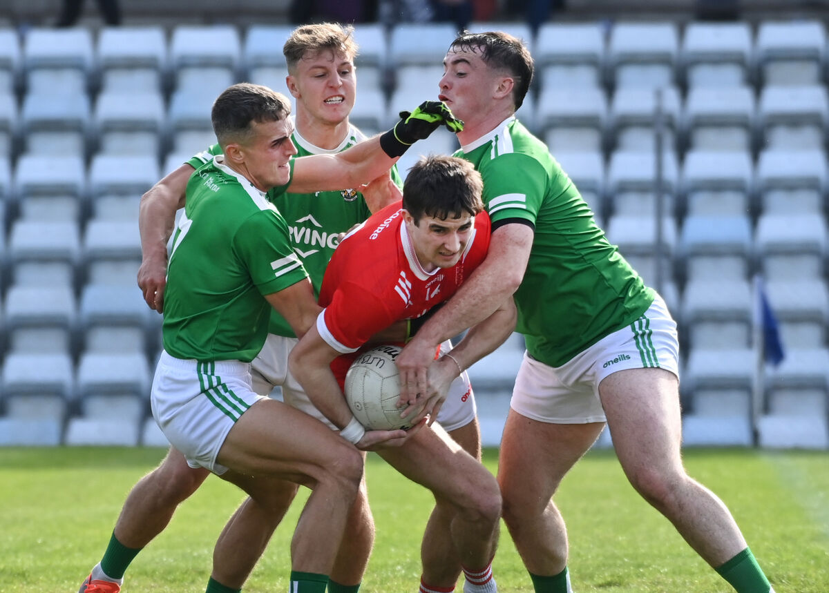 Uíbh Laoire's Chris Óg Jones is tackled by Aghada's Jake O'Donoghue, Kyle O'Shea and Jack Colbert at Páirc Uí Rinn. Picture: Eddie O'Hare Uíbh Laoire's Chris Óg Jones is tackled by Aghada's Jake O'Donoghue, Kyle O'Shea and Jack Colbert at Páirc Uí Rinn. Picture: Eddie O'Hare