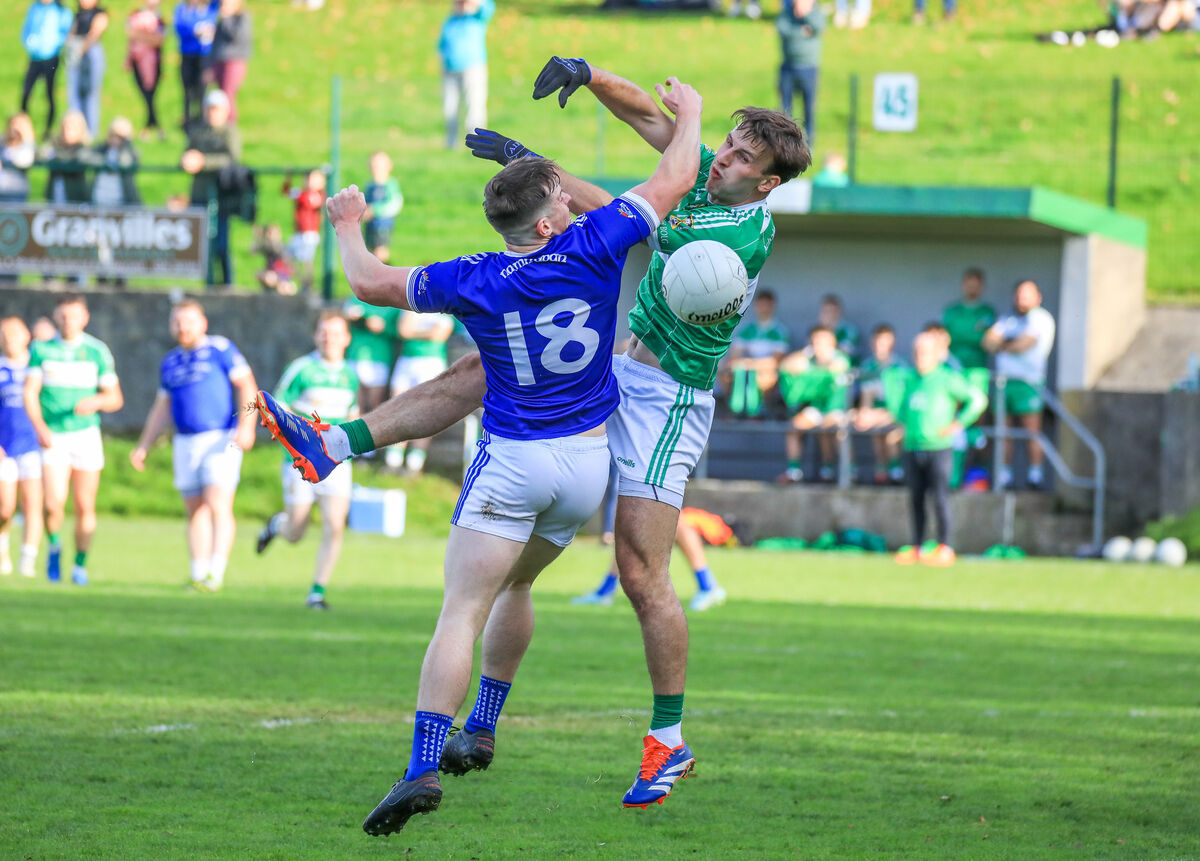 Naomh Abán's Aidan Lucey and Aghabullogue's Conor Smyth battle for possession. Picture: David Creedon Naomh Abán's Aidan Lucey and Aghabullogue's Conor Smyth battle for possession. Picture: David Creedon
