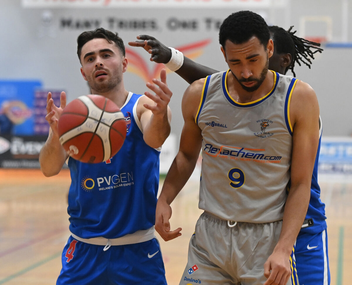 UCC Demons' Scott Hannigan gathers the ball from Flexachem Killorglin's Patrick Lanipekun. Picture: Eddie O'Hare