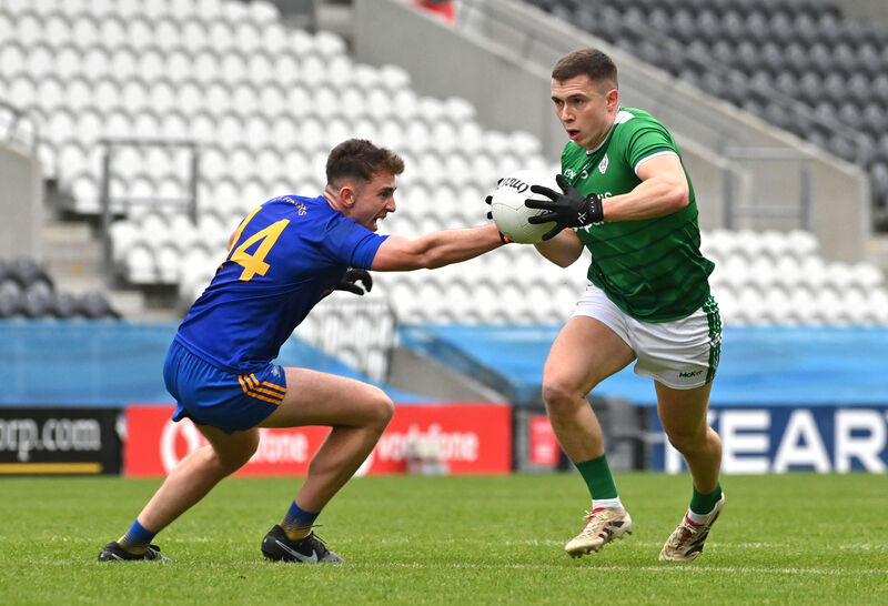  Ethan Twomey of St Finbarr's looks to stop the breaking Luke Fahy of Ballincollig. Picture: Dan Linehan