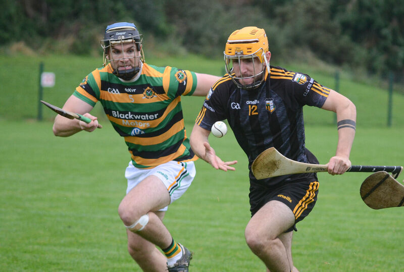 Kilbrittain's Josh O'Donovan - in a black change kit - tries to get away from James Mulcahy of Glen Rovers in the 2023 Co-op SuperStores Premier JHC quarter-final. The west Cork side will change for Friday's final too. Picture: Howard Crowdy
