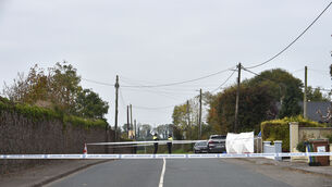 <p> Garda members at the cordoned off scene following the discovery of a man’s body at Rockview Terrace, Doneraile, early on Sunday morning. Picture: Dan Linehan</p>