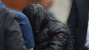 <p> Alex Deady, his face covered, is brought to Mallow Courthouse, Co Cork, where he was charged with murder. Picture: Dan Linehan.</p>