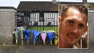 <p>Flowers at the residence on Rockview Terrace, Doneraile, Co Cork, where the body of postman Barry Daly was discovered on Sunday morning. Picture Dan Linehan</p>