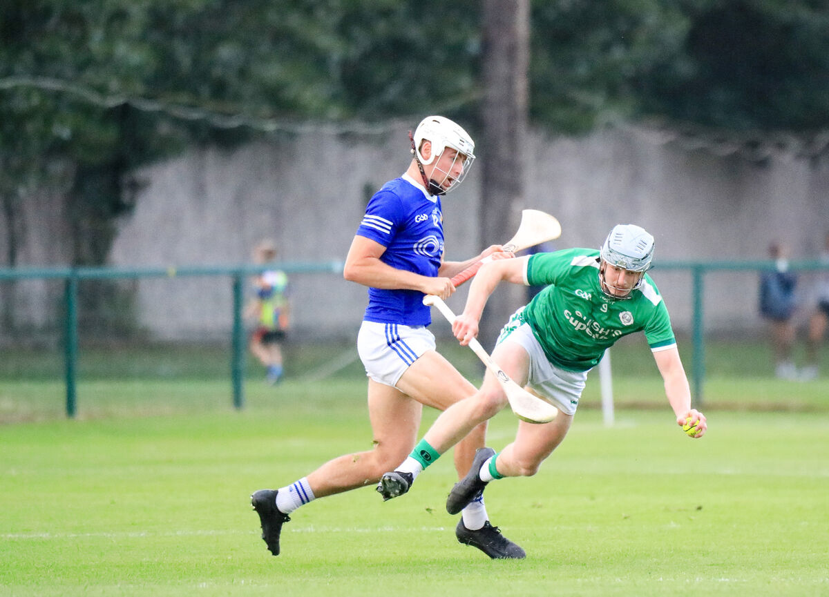 Ballincollig's Theo Morgan is tackled by Ballinhassig's Evan Cullinane. Picture: David Creedon Ballincollig's Theo Morgan is tackled by Ballinhassig's Evan Cullinane. Picture: David Creedon