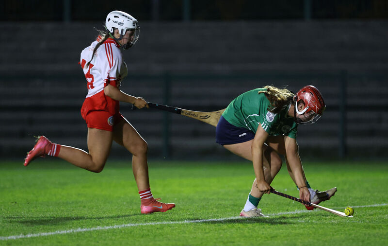  Cara O'Sullivan, Ballincollig, gets to the sliotar ahead of Hayley Sweeney, Ballygarvan. Picture: Jim Coughlan.