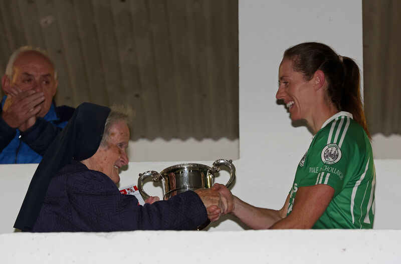  Sr Mary John presents the cup to Linda Dorgan. Picture: Jim Coughlan.