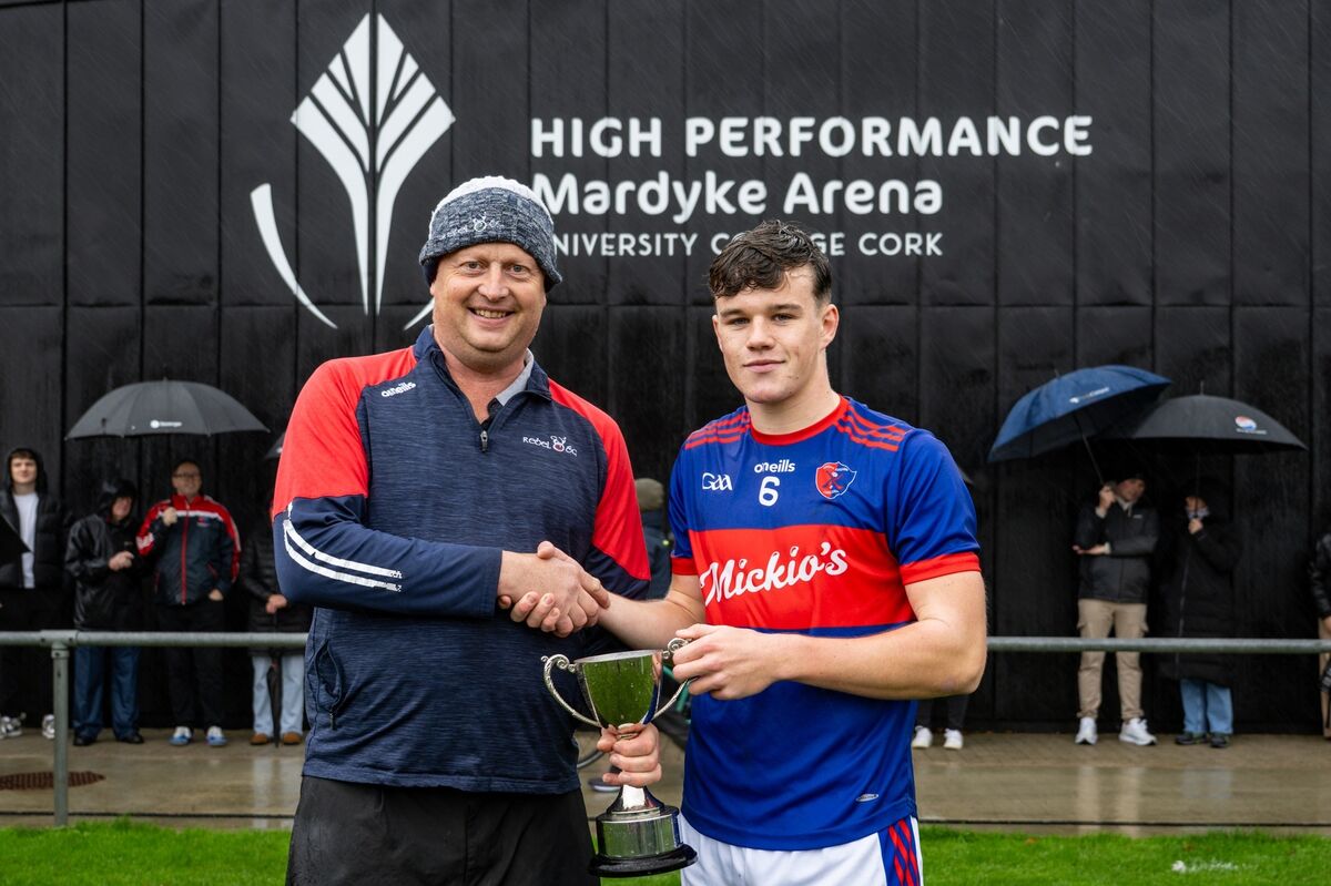 Rebel Óg Chairman Peter Watson presents the Fé16 Premier Hurling Challenge Cup to Erin’s Own captain David Nolan. Picture Chani Anderson.