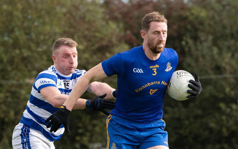 St Finbarr's Jamie Burns breaks away from Castlehaven's Brian Hurley. Picture: Howard Crowdy
