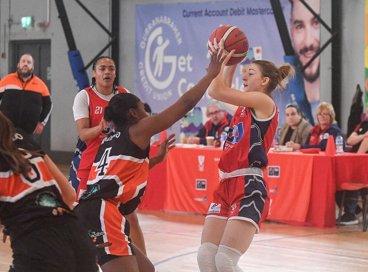  Brunell's Edel Thornton gets her pass away under pressure from Killester's Sam Haiby during their Women's Super League clash at the Parochial Hall.