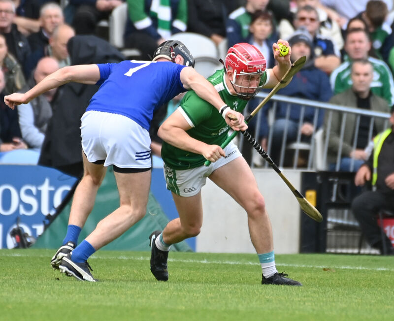 Ballincollig's Tadhg O'Connell is tackled by Ballinhassig's Eoin Lombard. Picture: Eddie O'Hare Ballincollig's Tadhg O'Connell is tackled by Ballinhassig's Eoin Lombard. Picture: Eddie O'Hare
