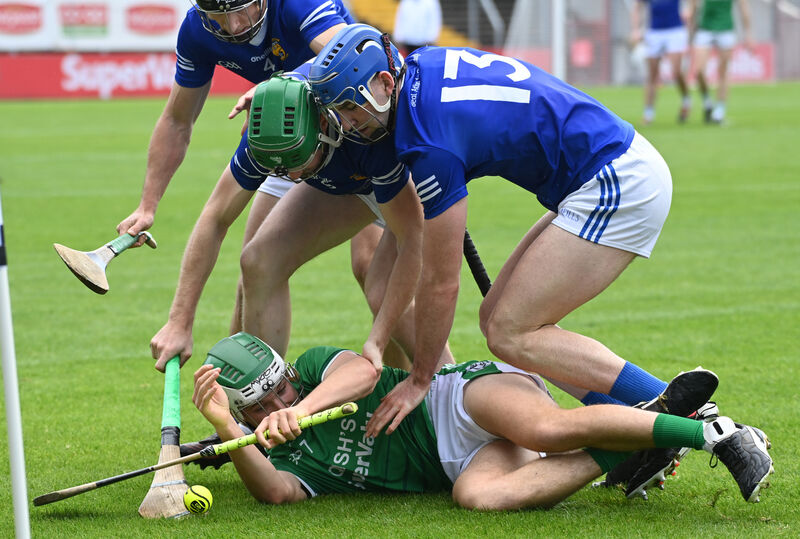 Ballincollig's David O'Leary is tackled by Ballinhassig's Patrick O'Leary, Conor Desmond and Simon O'Neill. Picture: Eddie O'Hare Ballincollig's David O'Leary is tackled by Ballinhassig's Patrick O'Leary, Conor Desmond and Simon O'Neill. Picture: Eddie O'Hare