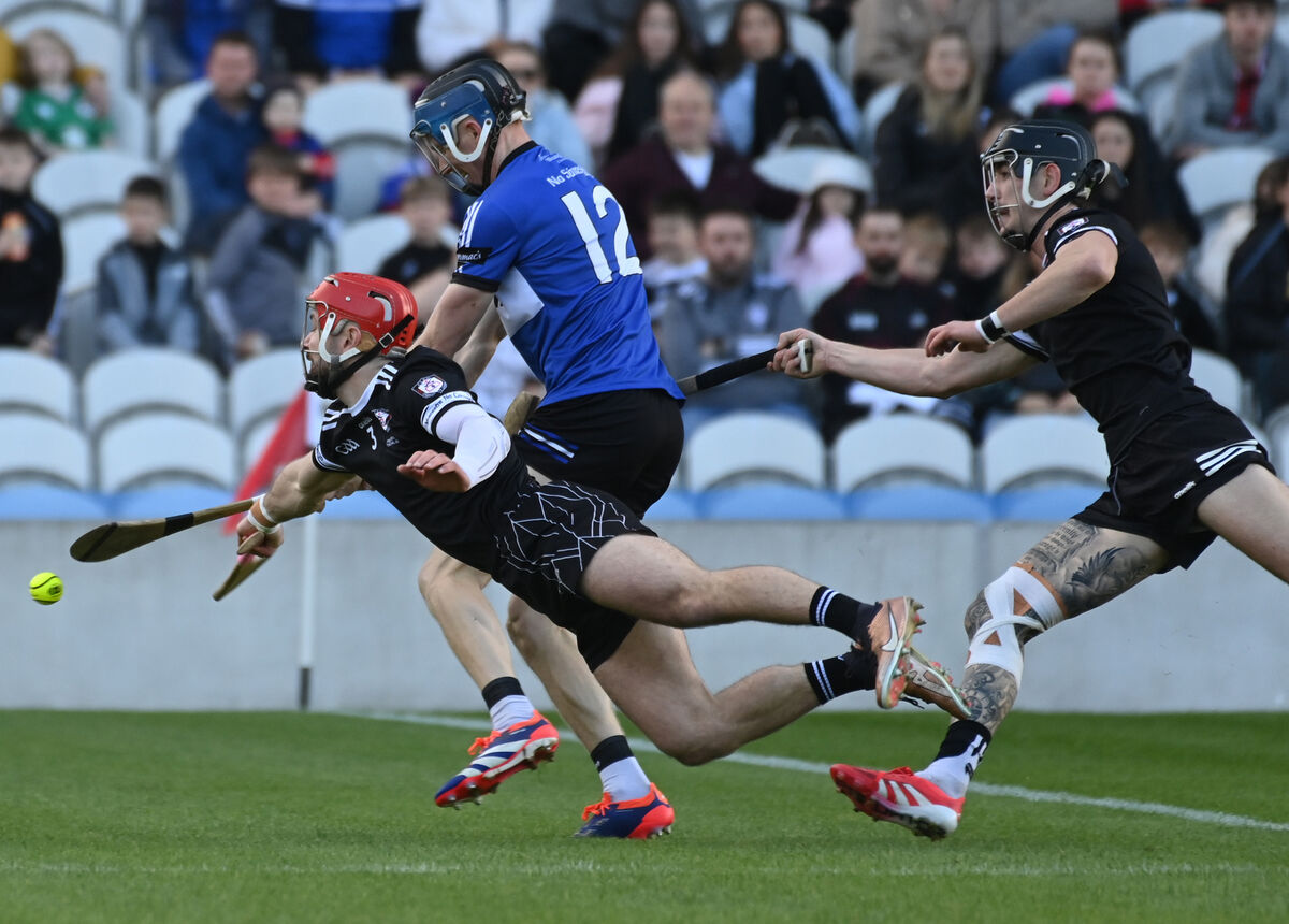 Sarsfields' Cian Darcy shoots from Midleton's Séadhnaidh Smyth. Picture: Eddie O'Hare Sarsfields' Cian Darcy shoots from Midleton's Séadhnaidh Smyth. Picture: Eddie O'Hare