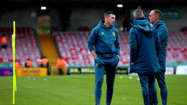 <p>Corks’ Manager Ger Nash talking to his coaching staff</p>