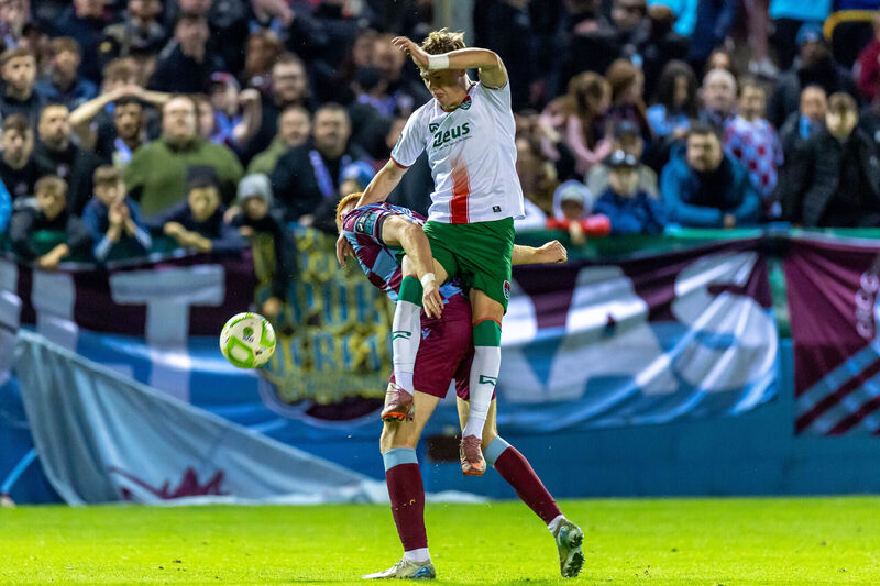 Drogheda United’s James Bolger with Brody Lee of Cork City Drogheda United’s James Bolger with Brody Lee of Cork City