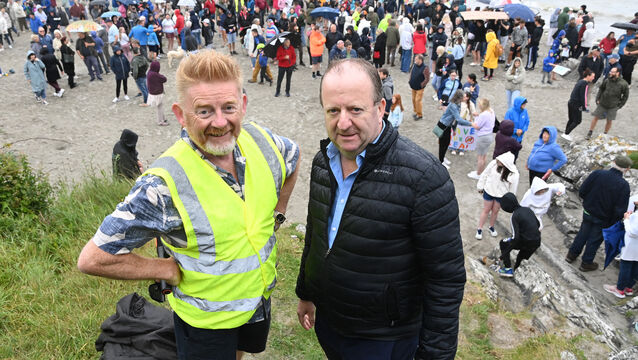 <p>Michael Collins, TD, and Marc O’Riain at the land-and-sea protest on the Dock Beach earlier this year. Picture: Eddie O'Hare.</p>