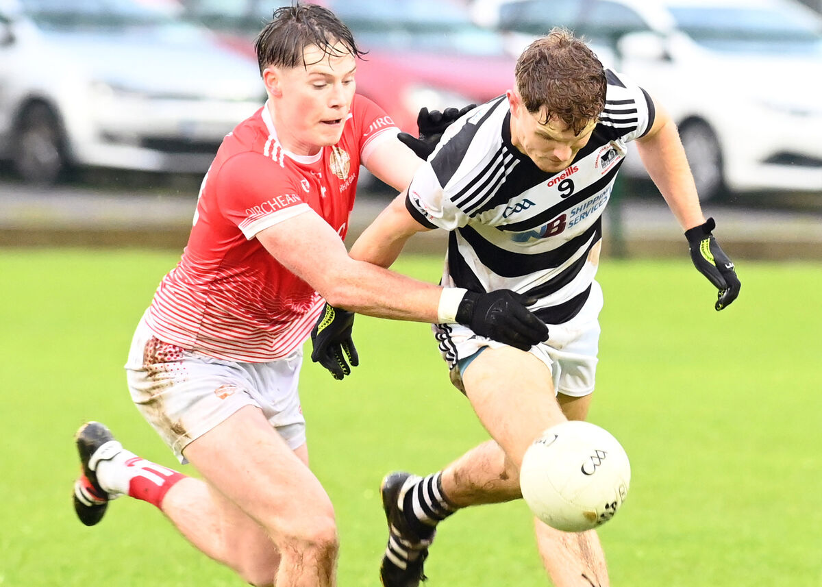 Urhan's Ciarán O'Sullivan and Donagh Coughlan of St Nick's contest a breaking ball. Picture: Martin Walsh.