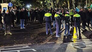 Fireworks launched at gardaí in clash with protesters at Citywest