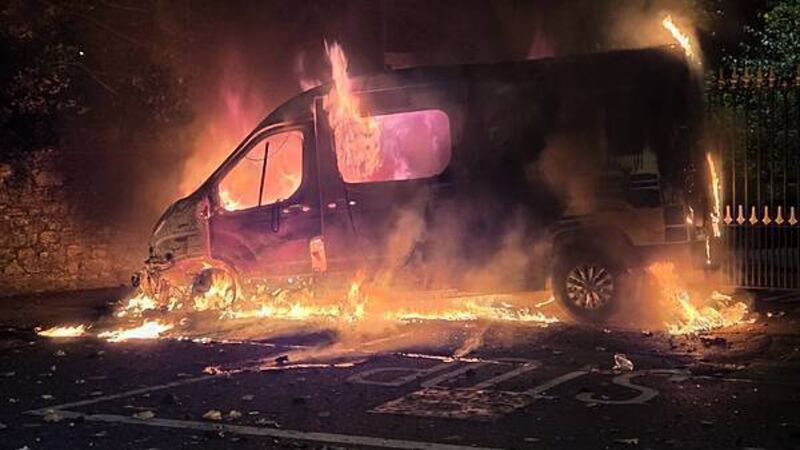 Fireworks launched at gardaí, Garda van set alight, in clash with protesters at Citywest Fireworks launched at gardaí, Garda van set alight, in clash with protesters at Citywest