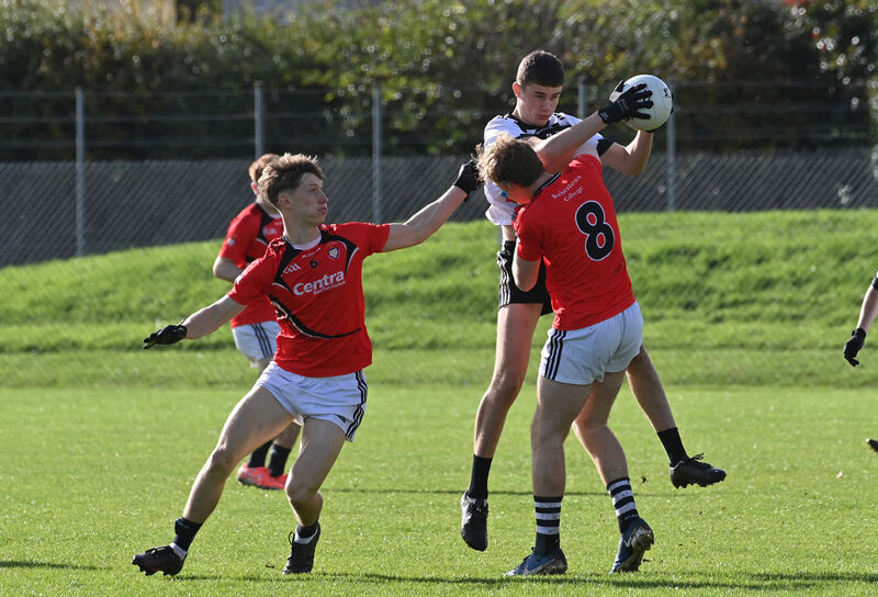  Micheál O'Mahony of Pobalscoil Inbhear Scéine Kenmare in a battle with Liam Collins of St Francis College Rochestown. Picture: Dan Linehan