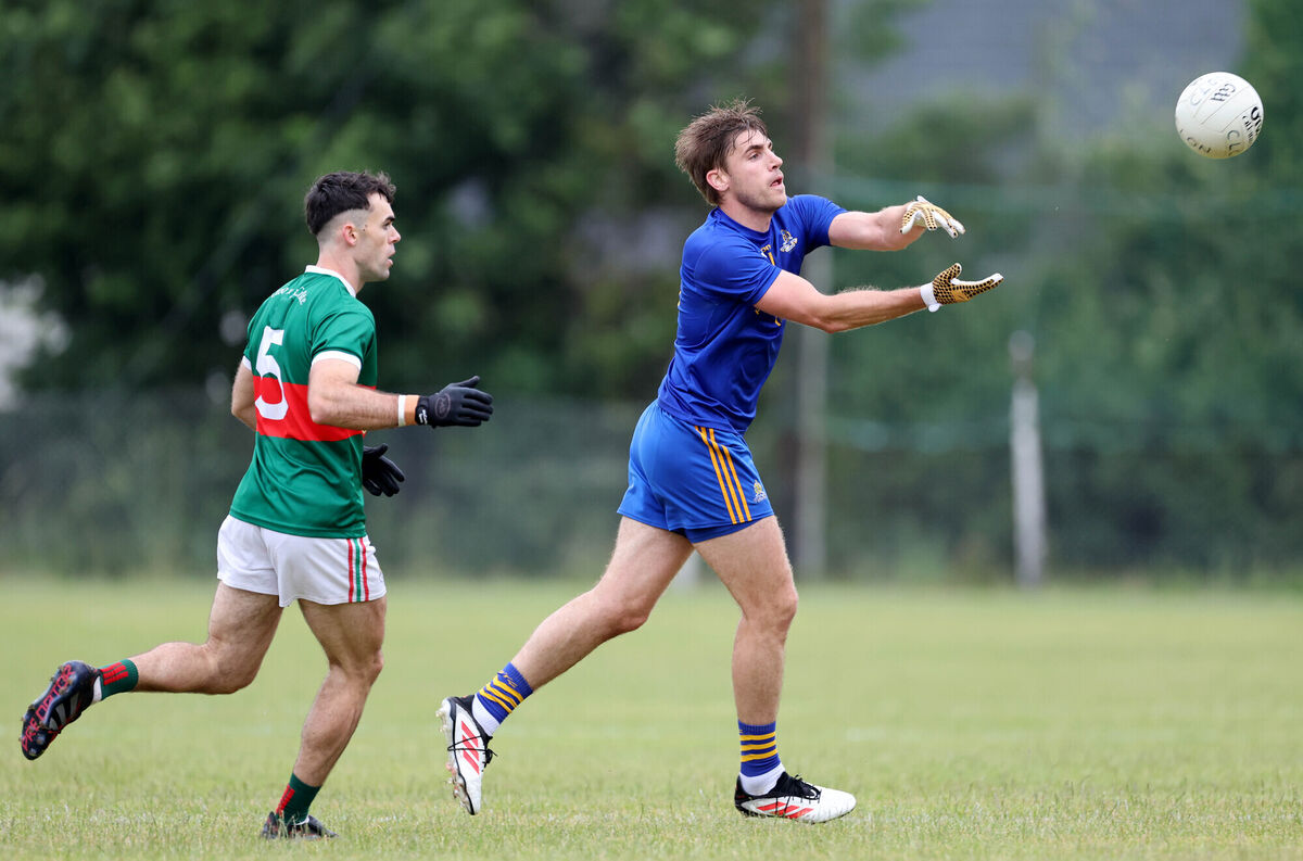 Ian Maguire, St Finbarr's, gets his handpass away from David Lowney, Clonakilty during the McCarthy Insurance Group Football League Division 1 Final at Ballygarvan. Picture: Jim Coughlan.  Ian Maguire, St Finbarr's, gets his handpass away from David Lowney, Clonakilty during the McCarthy Insurance Group Football League Division 1 Final at Ballygarvan. Picture: Jim Coughlan.