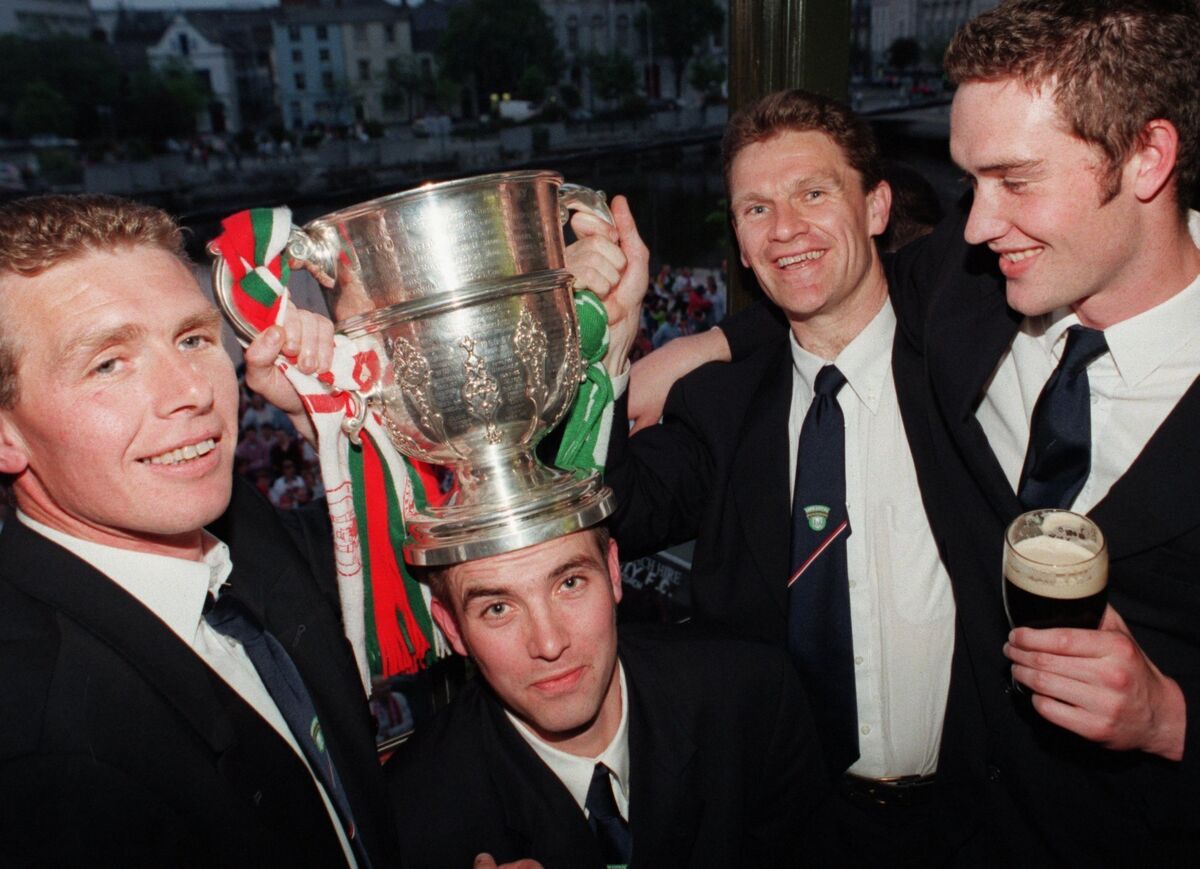 Cork City players Patsy Freyne, Derek Coughlan, Declan Daly and Noel Hartigan with the FAI cup during the parade through Cork City. Picture: Eddie O'Hare
