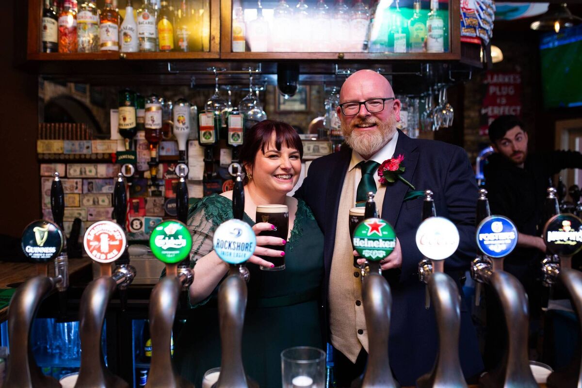 The couple's photographer captured pictures of their wedding right across the city, and even got a snap of them pulling pints.  The couple's photographer captured pictures of their wedding right across the city, and even got a snap of them pulling pints.