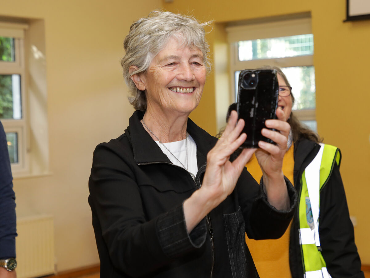 Presidential candidate Catherine Connolly TD taking a picture of artwork when she visited the community centre in Blackpool. Picture: David Creedon. Presidential candidate Catherine Connolly TD taking a picture of artwork when she visited the community centre in Blackpool. Picture: David Creedon.