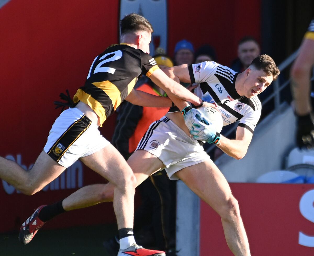 St Nick's Robert Downey is tackled by Buttevant's Aaron Trimm. Picture: Eddie O'Hare