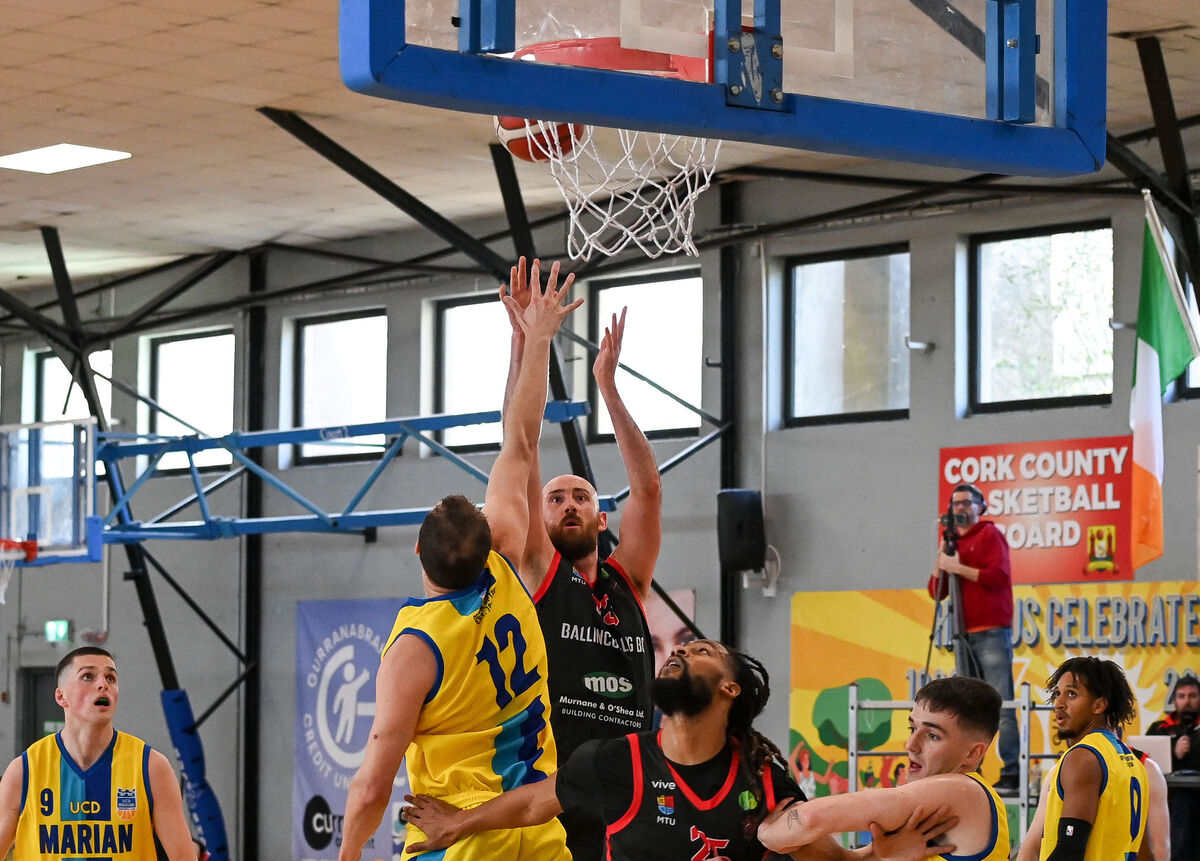  Ballincollig's Keelan Cairns shoots past UCD Marian's Tanner Graham. Picture: David Keane.