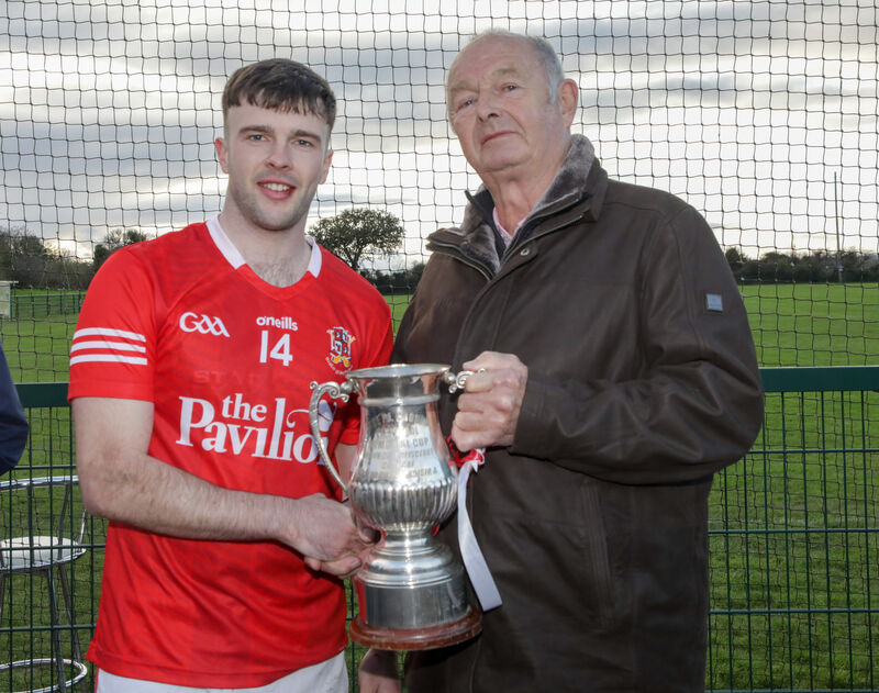 Myles Barry presents the trophy to Ray O'Halloran of Ballygarvan. Picture: David Creedon