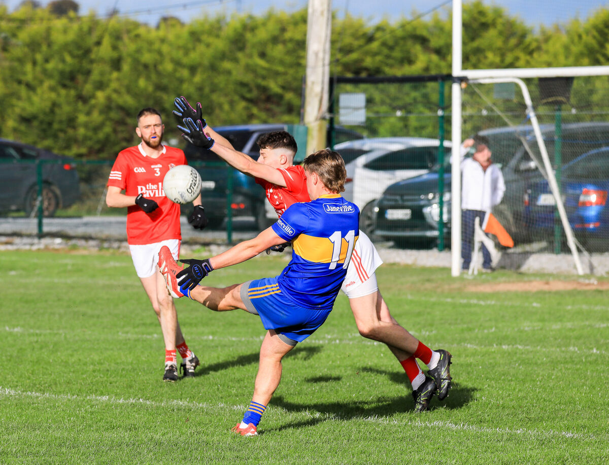 Ballygarvan's Stephen Fenton blocks a shot at goal by Carrigaline's Jack McGrath. Picture: David Creedon Ballygarvan's Stephen Fenton blocks a shot at goal by Carrigaline's Jack McGrath. Picture: David Creedon