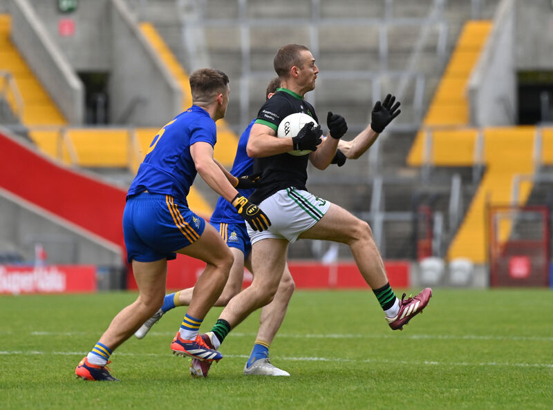Conor Horgan of Nemo Rangers is tackled by St Finbarr's players Dylan Quinn and Sam Ryan. Picture: Dan Linehan  Conor Horgan of Nemo Rangers is tackled by St Finbarr's players Dylan Quinn and Sam Ryan. Picture: Dan Linehan