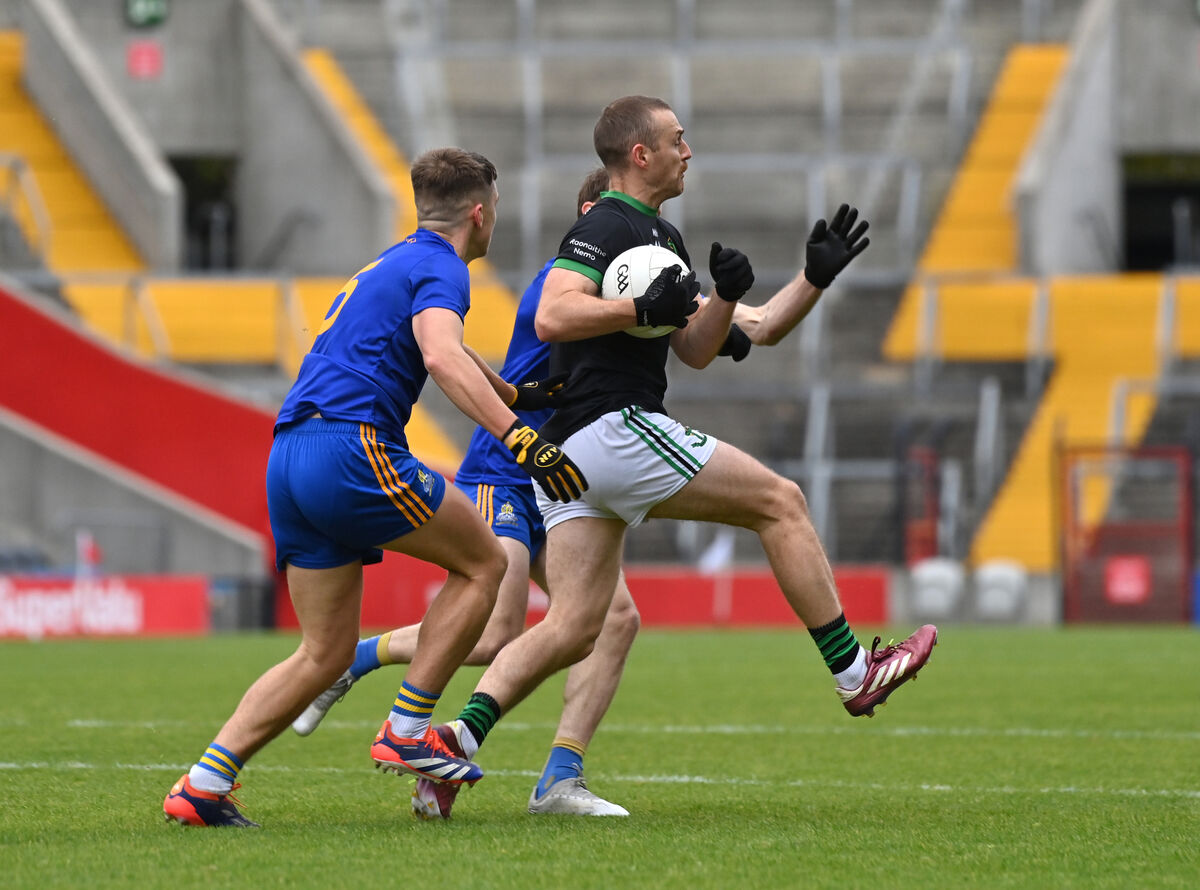  Conor Horgan of Nemo Rangers is tackled by St Finbarr's players Dylan Quinn and Sam Ryan. Picture: Dan Linehan