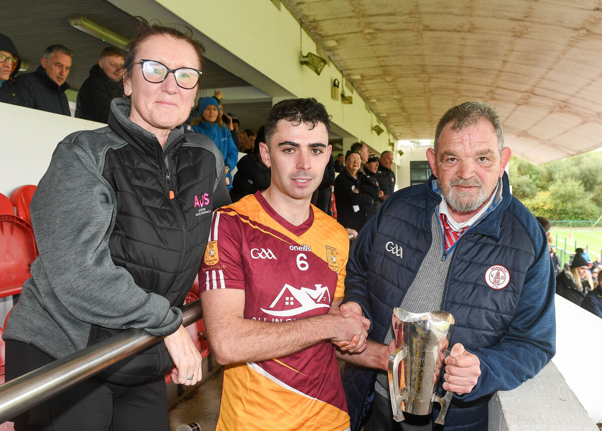 City Division chairman Mick Buckley presents the cup to Whitechurch captain Mark Callanan, along with Jess O'Sullivan of AOS Security (sponsor). Picture: David Keane.