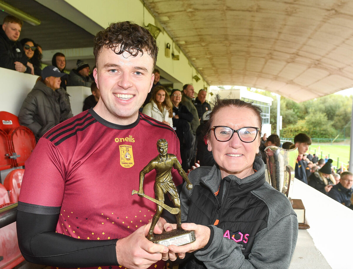 Jess O'Sullivan of AOS Security presents the Man of the Match award to Con Mulcahy of Whitechurch. Picture: David Keane.