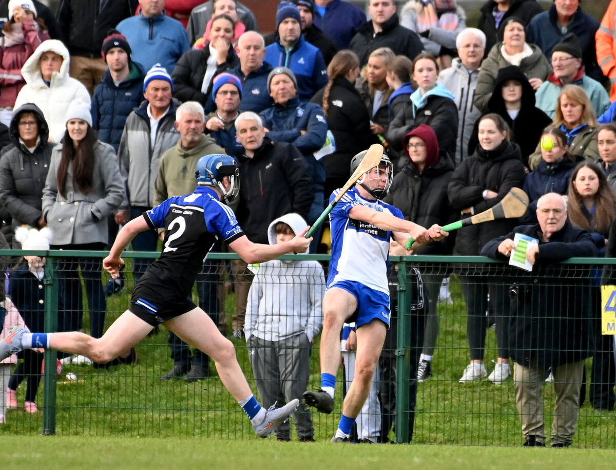 All eyes on Belgooly's Eoin O'Donovan scores a point on the sideline from Kinsale's Senan Aherne. Picture: Eddie O'Hare