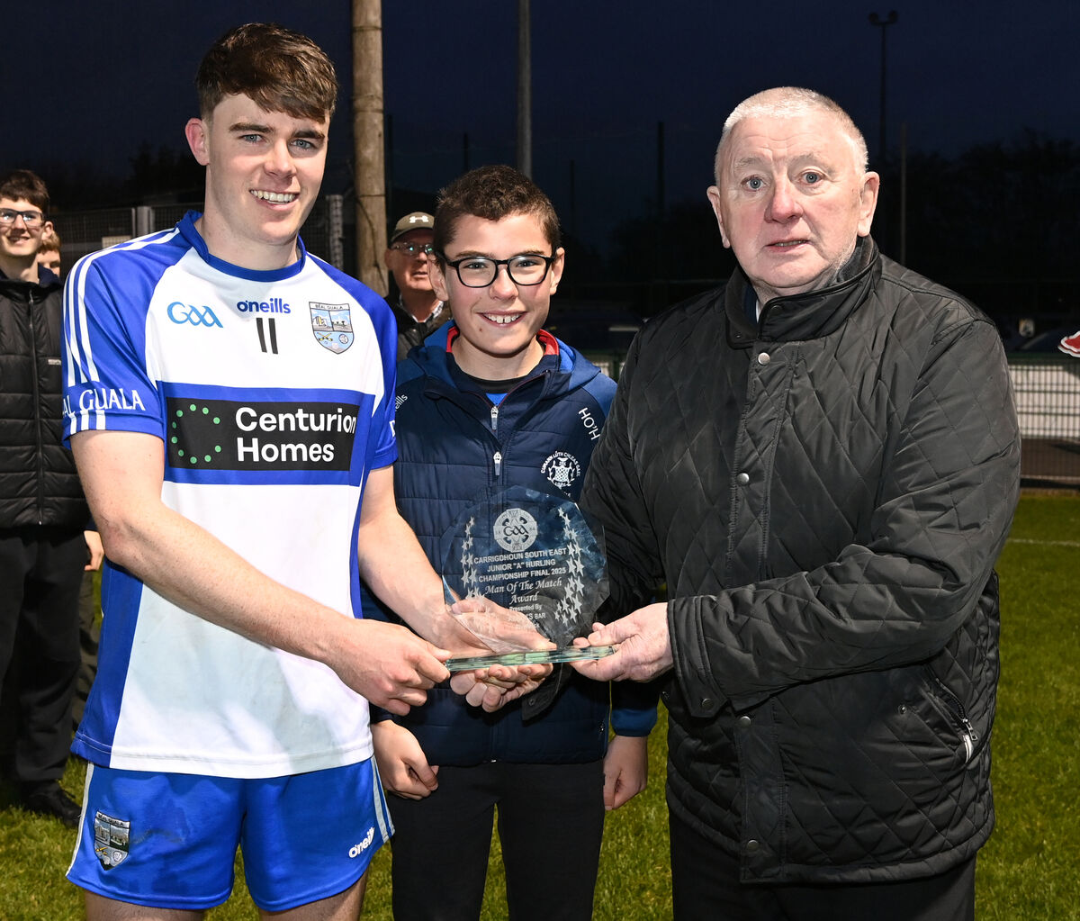 Harry O'Hanlon and Kevin O'Donovan present the Allen's Bar Riverstick Man of the Match award to Belgooly captain Eoin O'Donovan. Picture: Eddie O'Hare