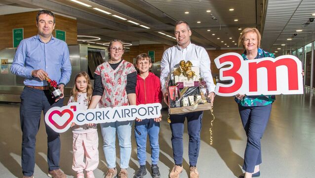 <p>Cork Airport staff welcoming Hannah Davison and her children, Emily and Joshua from Horsham who was the three millionth passenger to use Cork Airport in 2025. - Picture: David Creedon</p>