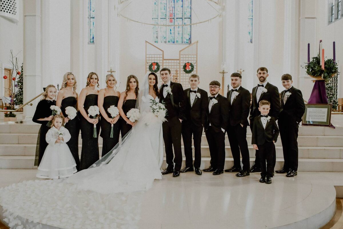 Laura and Greg with their bridal party at the North Cathedral where Laura’s own parents were also wed. Laura and Greg with their bridal party at the North Cathedral where Laura’s own parents were also wed.
