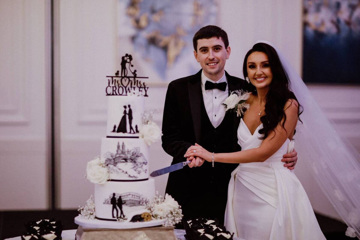 Laura and Greg’s “delicious” wedding cake was made by Trace of Cakes. Laura and Greg’s “delicious” wedding cake was made by Trace of Cakes.