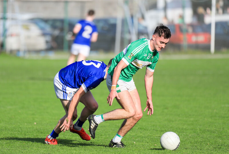 Aghabullogue's Aaron O'Sullivan tries to gather the ball against Naomh Abán. Picture: David Creedon Aghabullogue's Aaron O'Sullivan tries to gather the ball against Naomh Abán. Picture: David Creedon