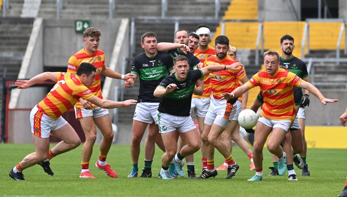 Newcestown players Micheál McSweeney and Luke Meade are first to react to this breaking ball ahead of Nemo Rangers players Ciaran McCartan and Kevin O'Donovan. Picture: Dan Linehan Newcestown players Micheál McSweeney and Luke Meade are first to react to this breaking ball ahead of Nemo Rangers players Ciaran McCartan and Kevin O'Donovan. Picture: Dan Linehan