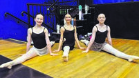 Lily Barry, Mia Kiss Barbosa, and Robyn O'Leary having no trouble at all performing the splits.jpg Cork youths preparing to perform alongside world famous ballet dancers